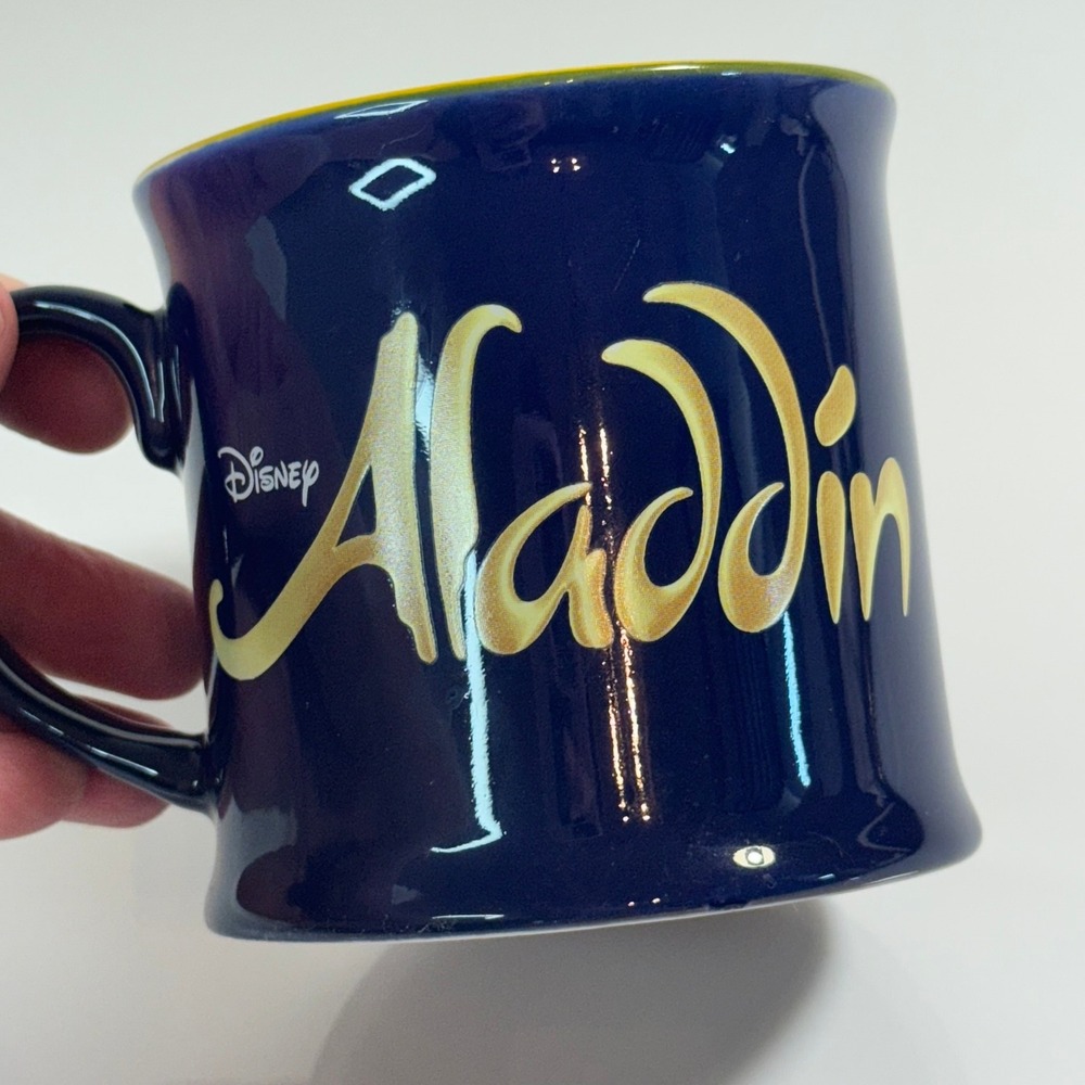 Disney Aladdin Navy Blue and Yellow Coffee Mug Genie Lamp Magic Carpet Cup
